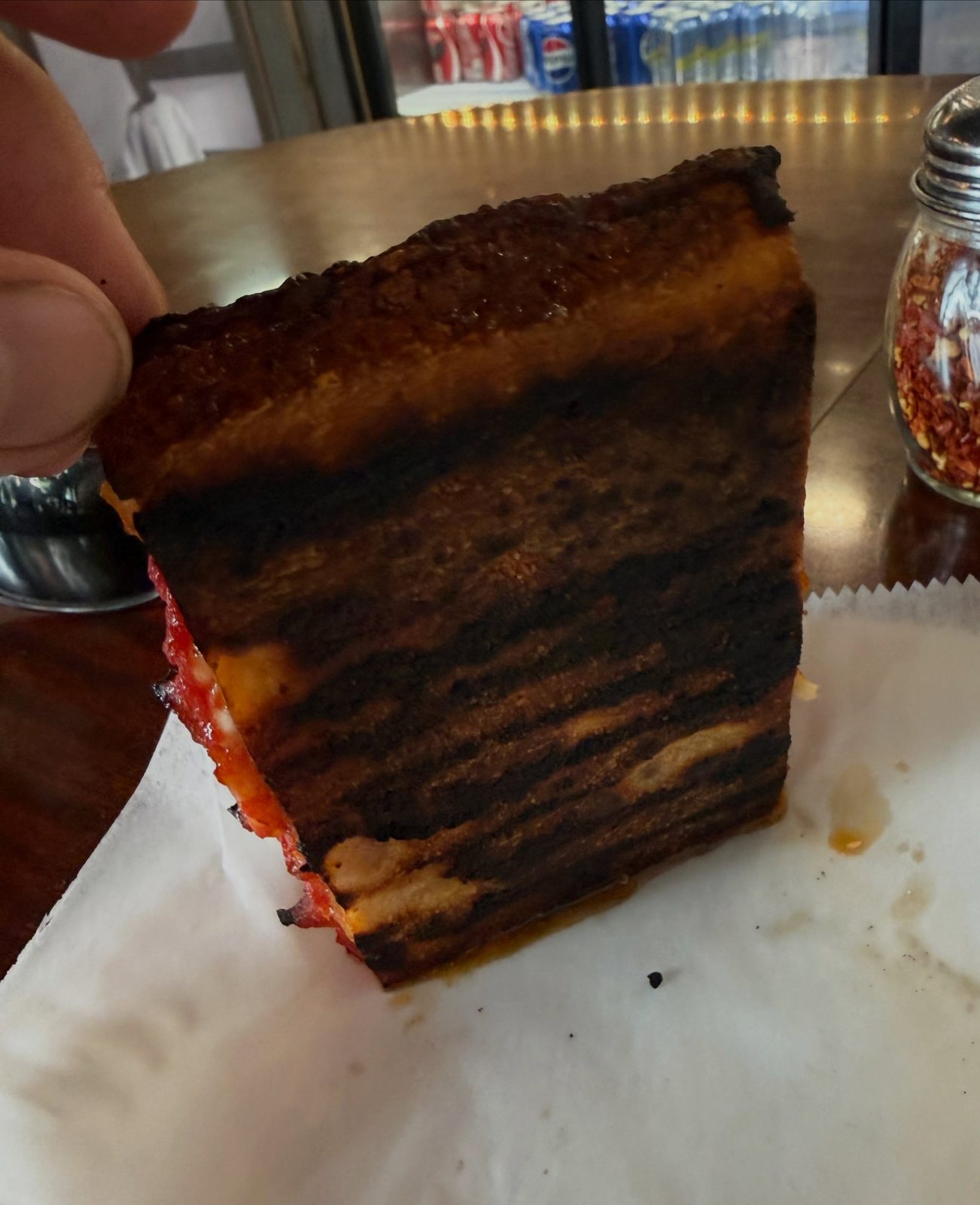 Underside of the pizza crust at Nate’s Detroit Pizza