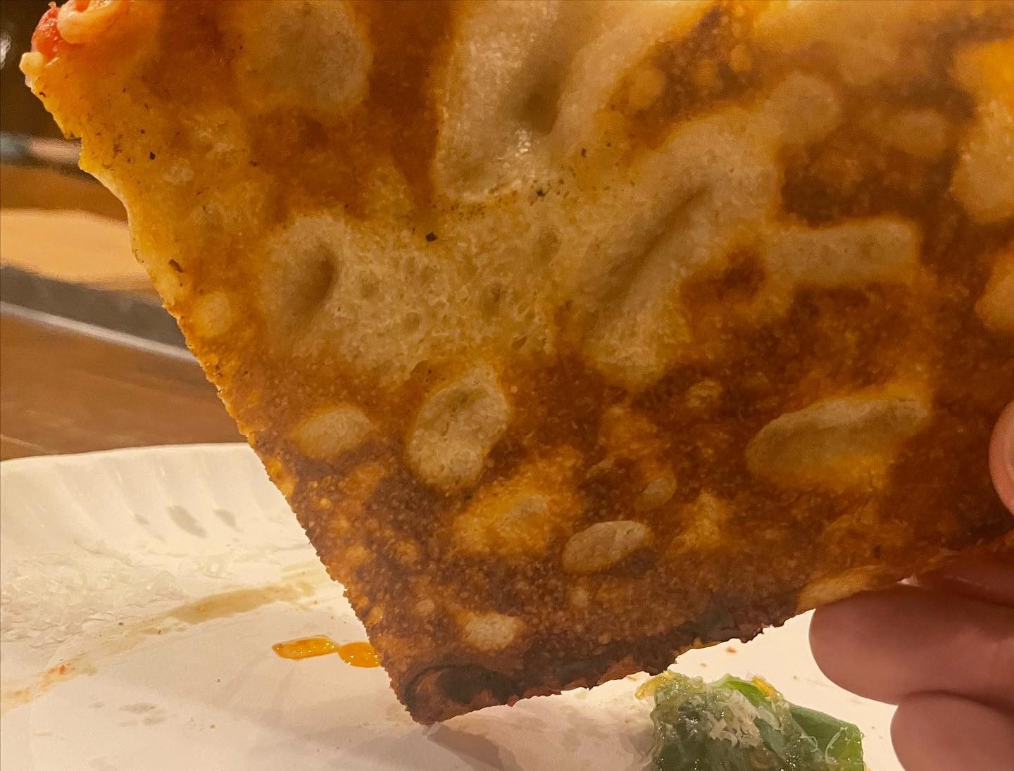 Underside of the pizza crust at Old Greg’s Pizza