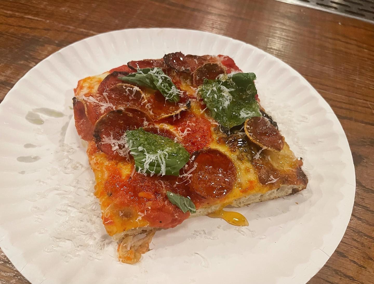 Square slice on a paper plate at Old Greg’s Pizza