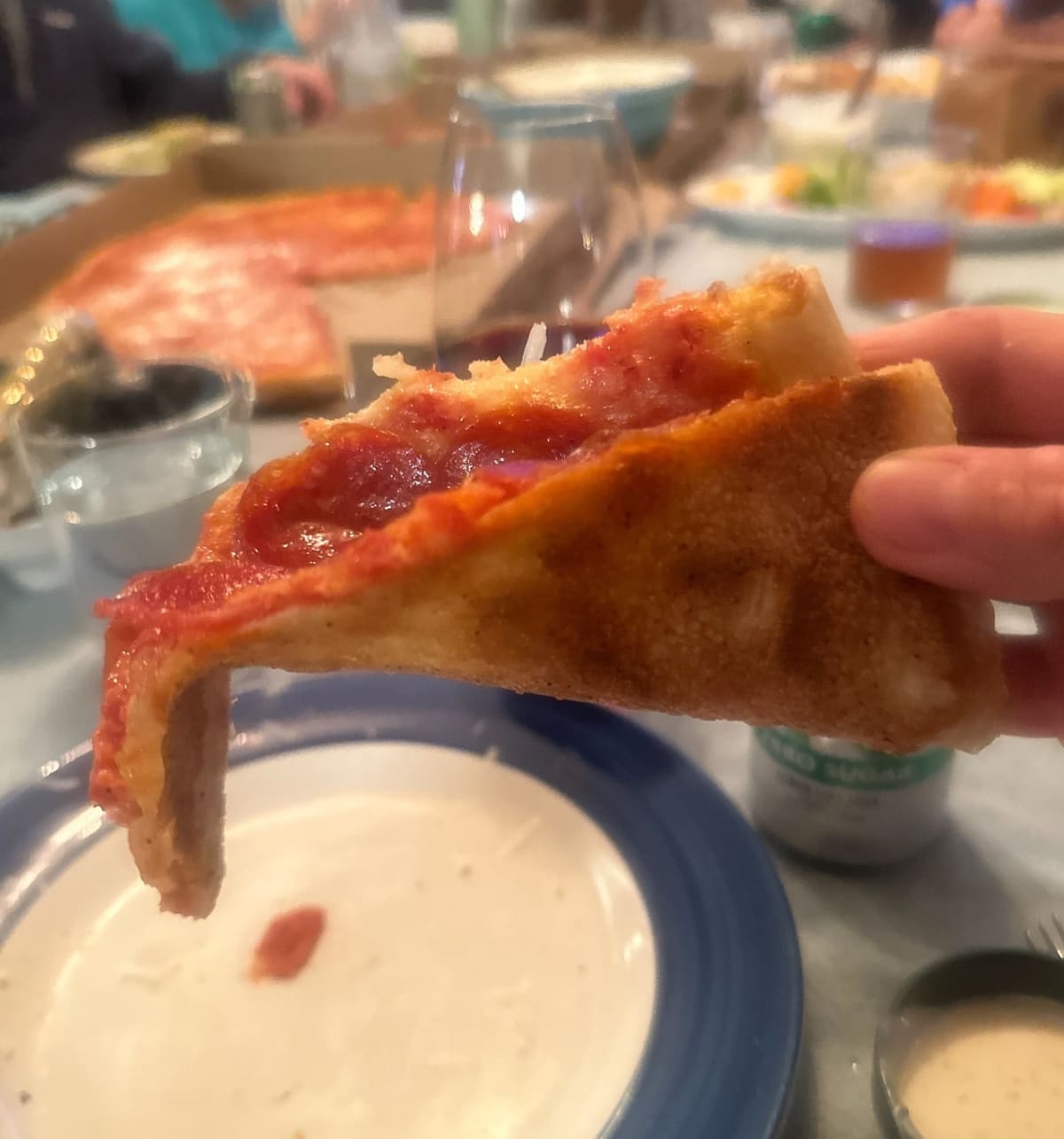 Close view of a pizza slice at Pastizza Pizza & Pasta
