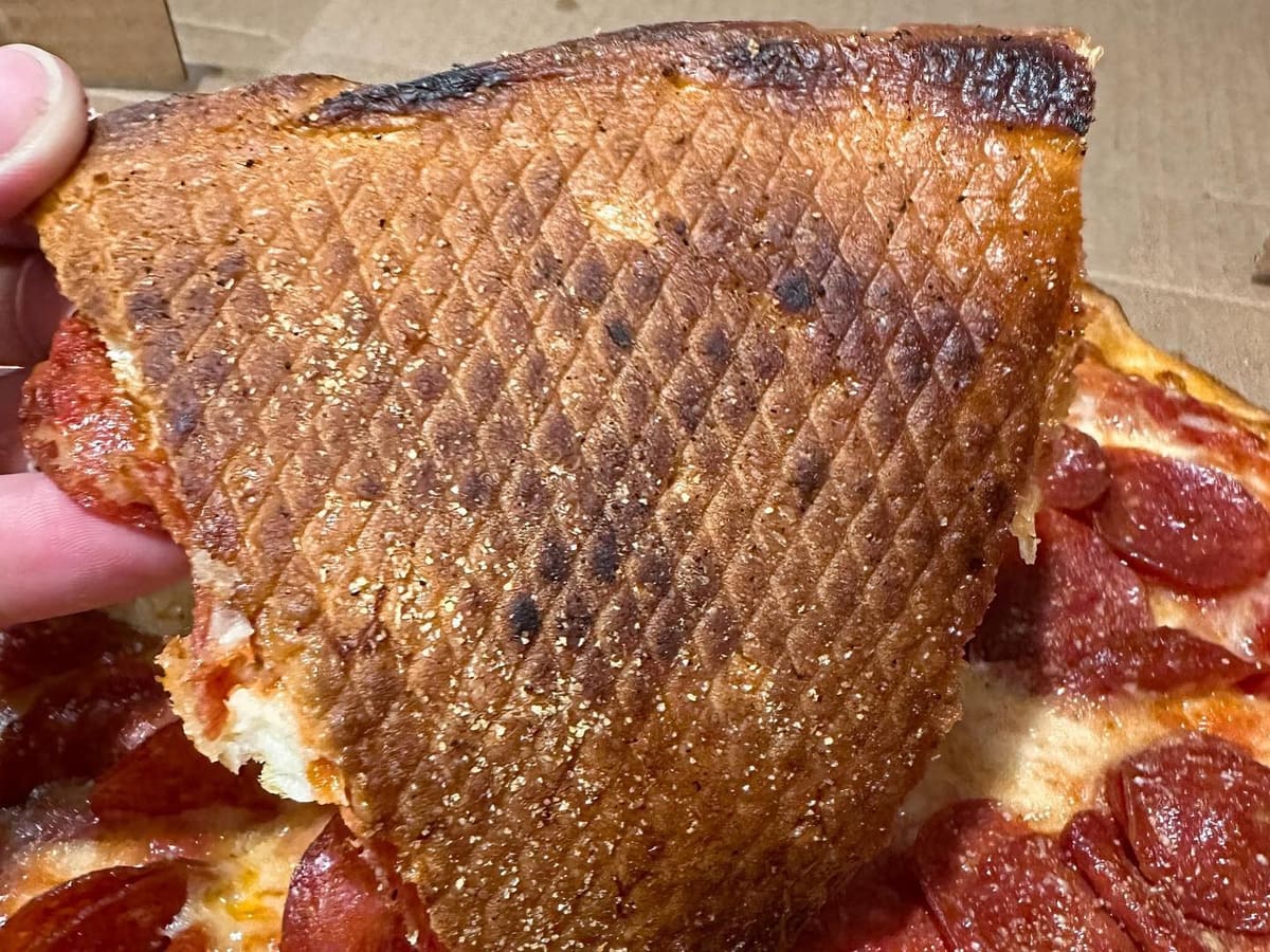 Underside of the pizza crust at Pizza Bank