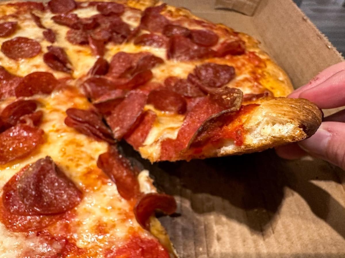 Close view of a pizza slice at Pizza Bank