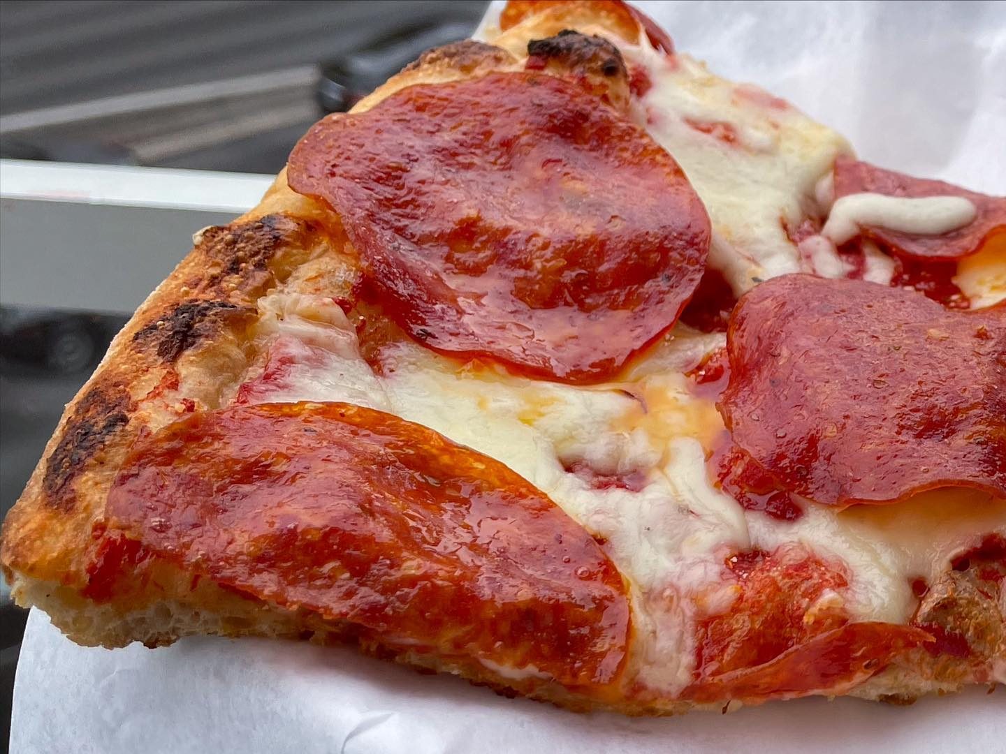 Close view of a pizza slice at Pizza D’Italia