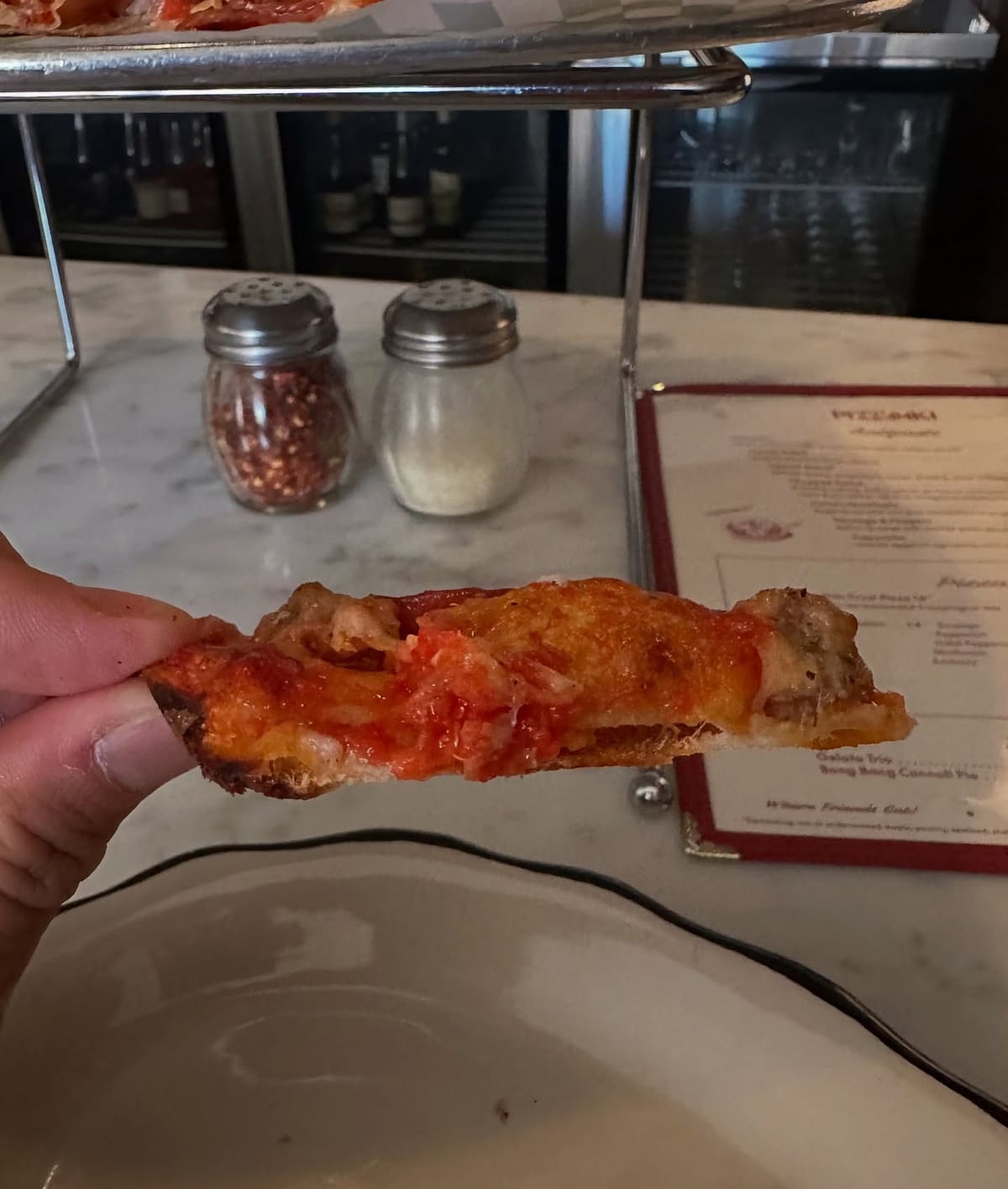 Pizza slice at Pizz’Amici
