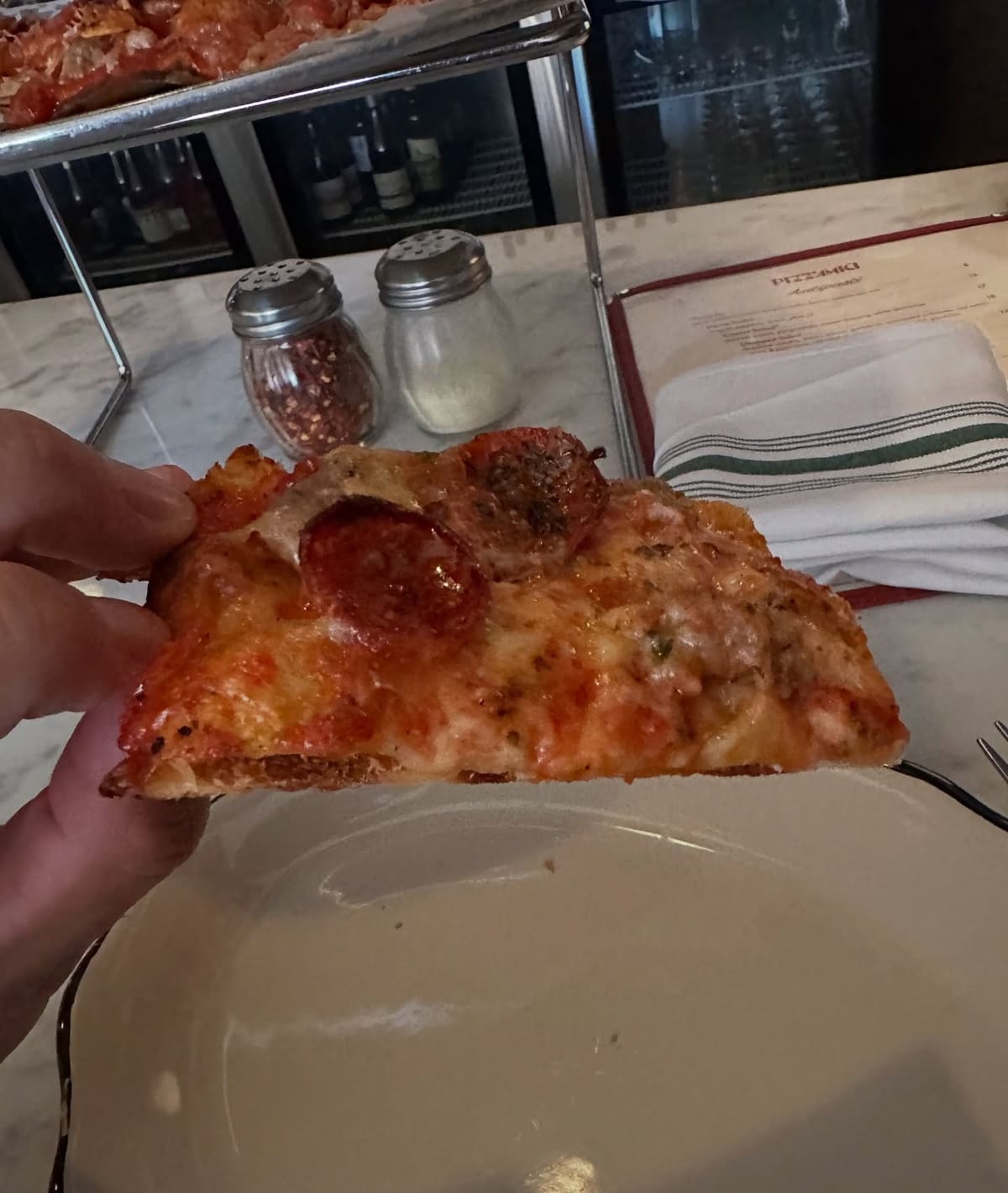 Side profile of the pizza crust at Pizz’Amici