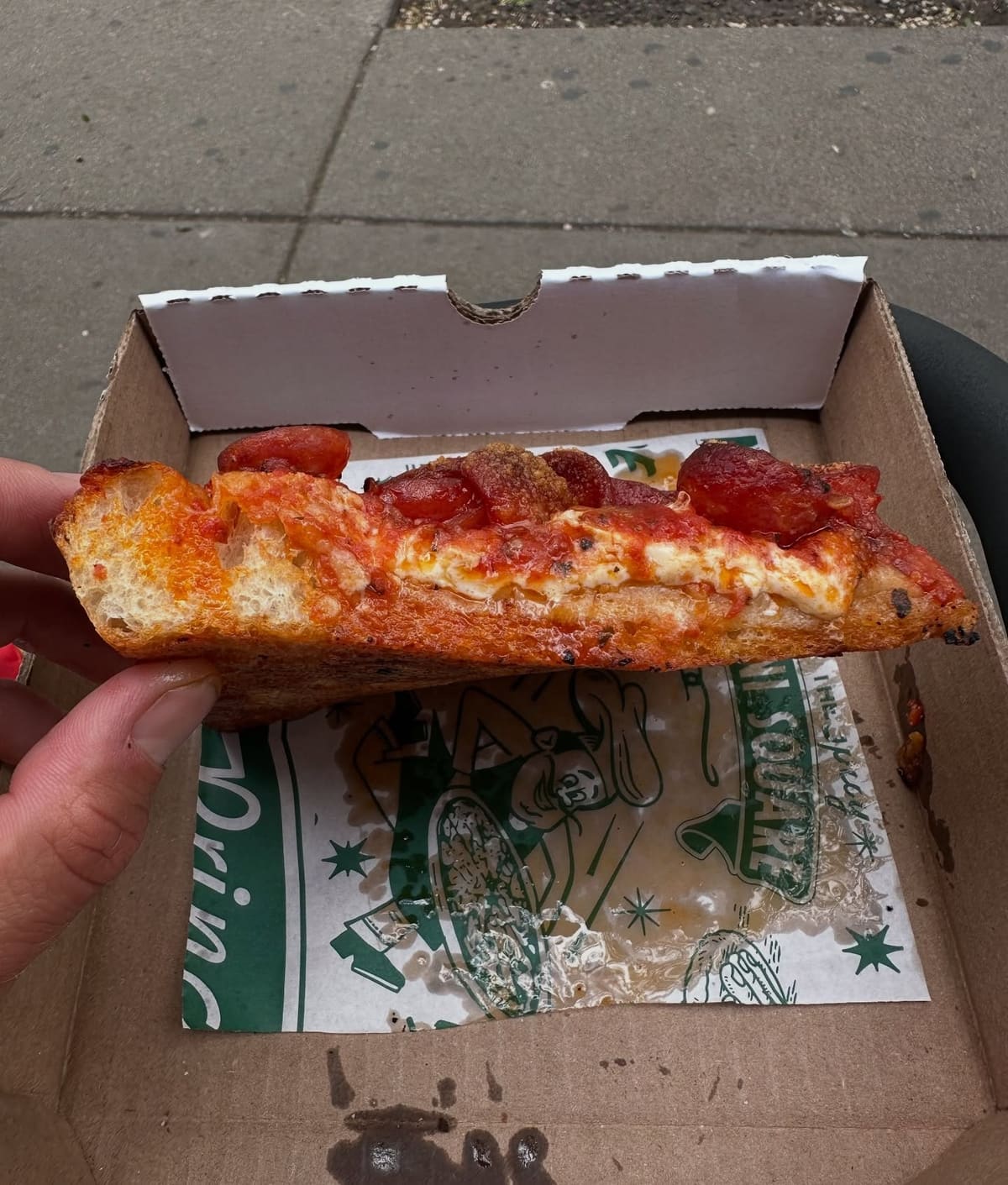 Square pizza slice at Prince Street Pizza