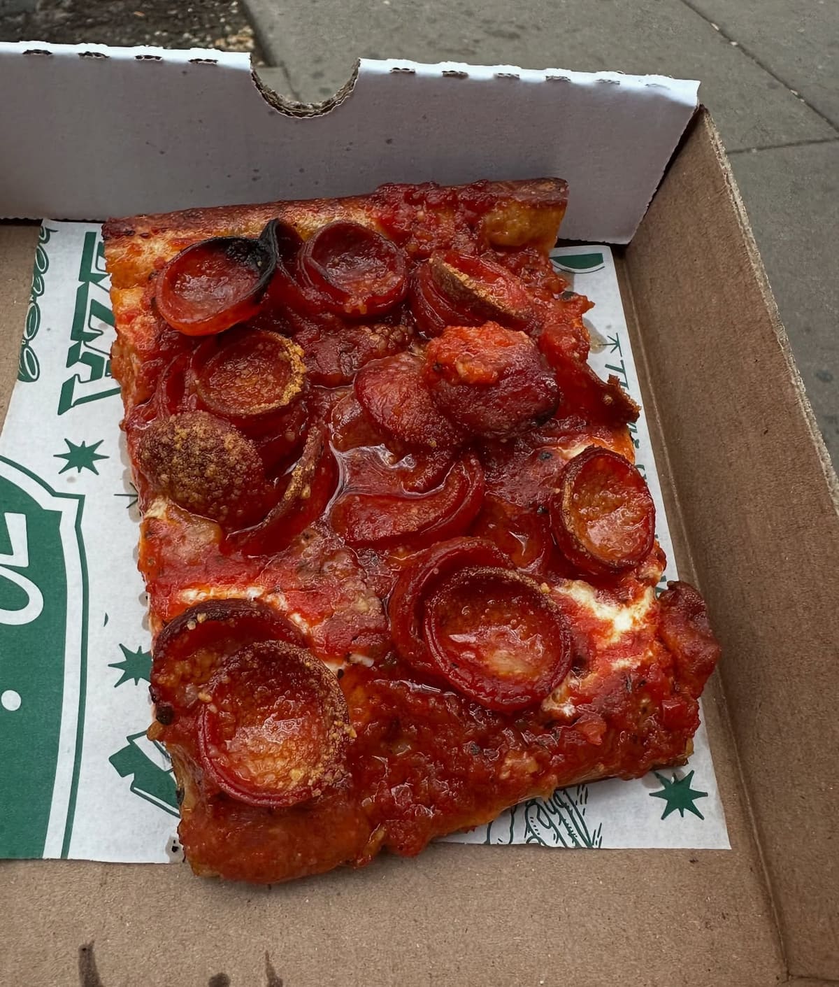 Square pizza slice at Prince Street Pizza