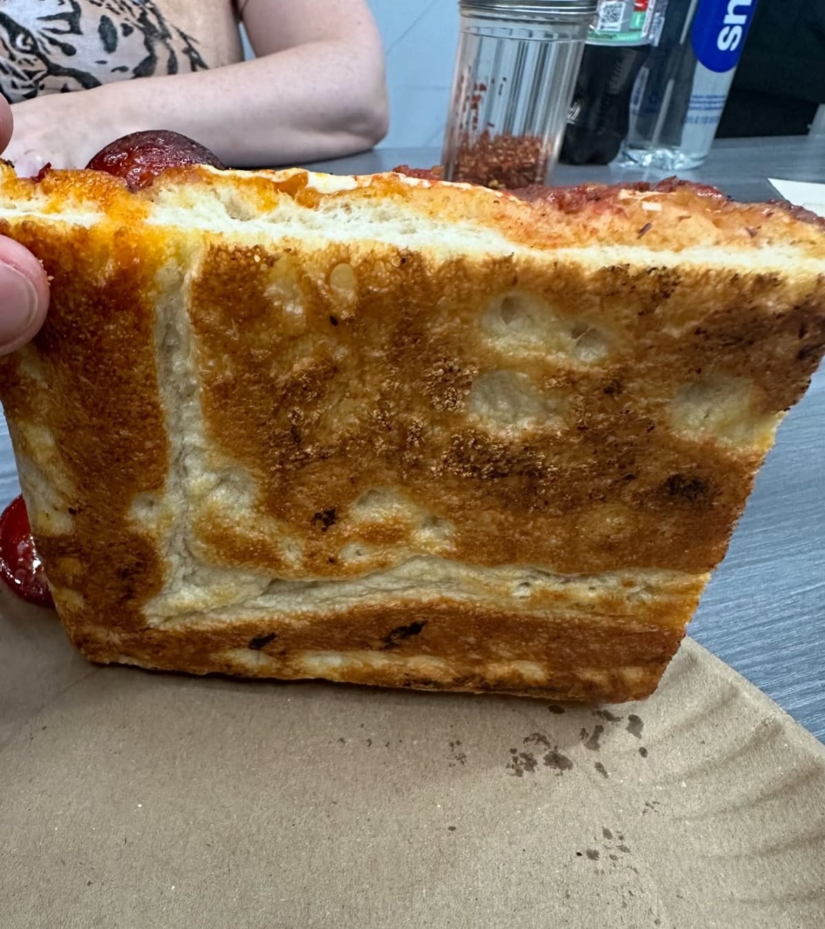 Underside of the pizza crust at Quality Pizza Co