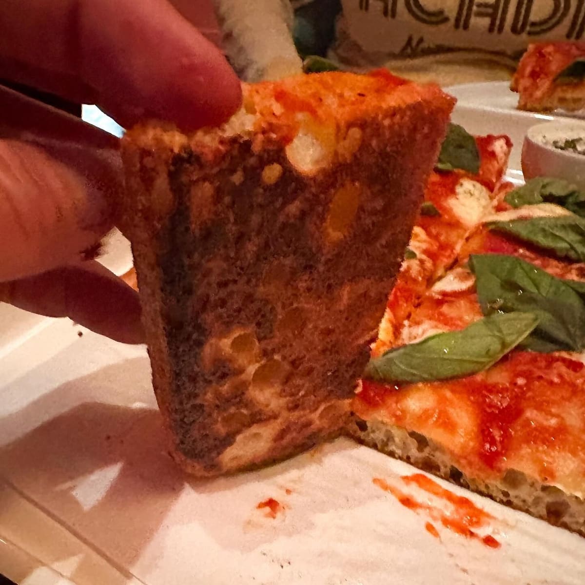 Underside of the pizza crust at Razzo