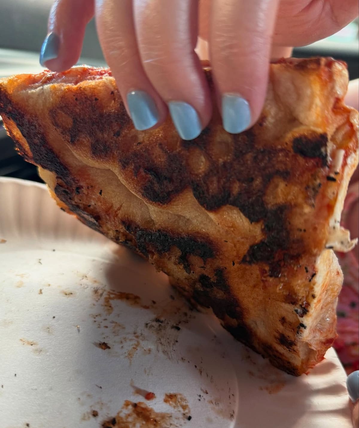 Underside of the pizza crust at Rosario’s Pizza in Astoria