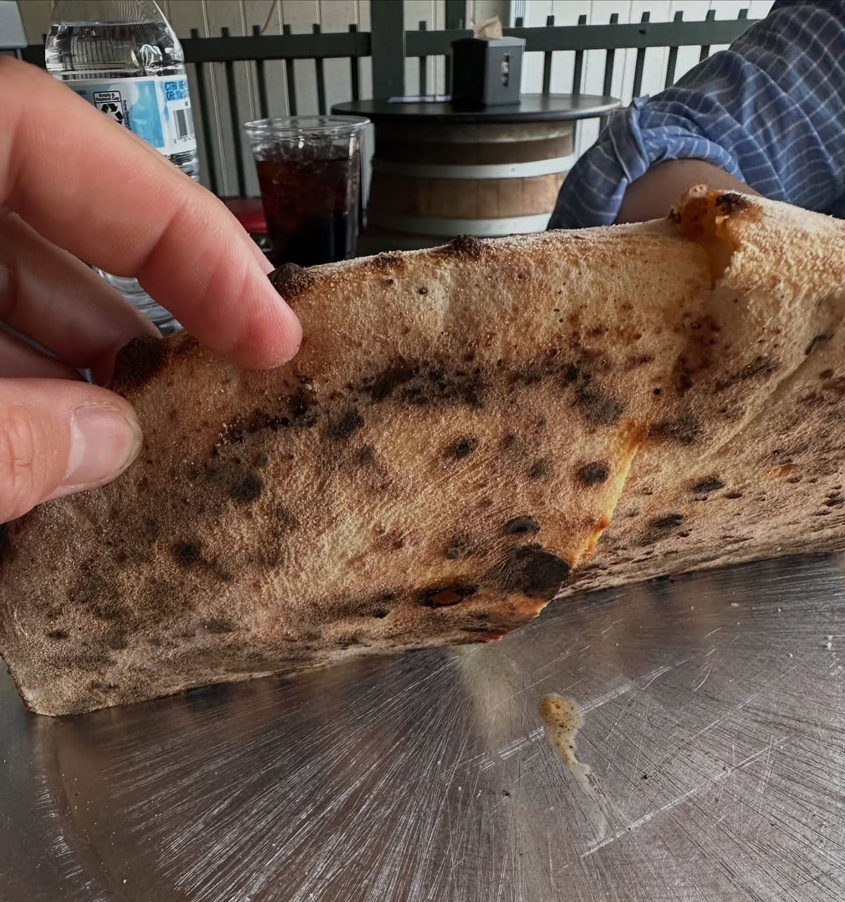 Underside of the pizza crust at Rossville Pizza Company