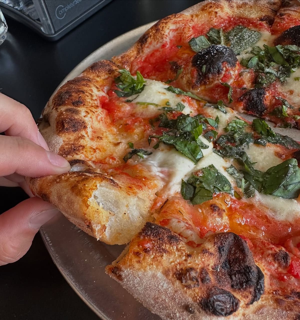 Close view of a pizza slice at Rossville Pizza Company
