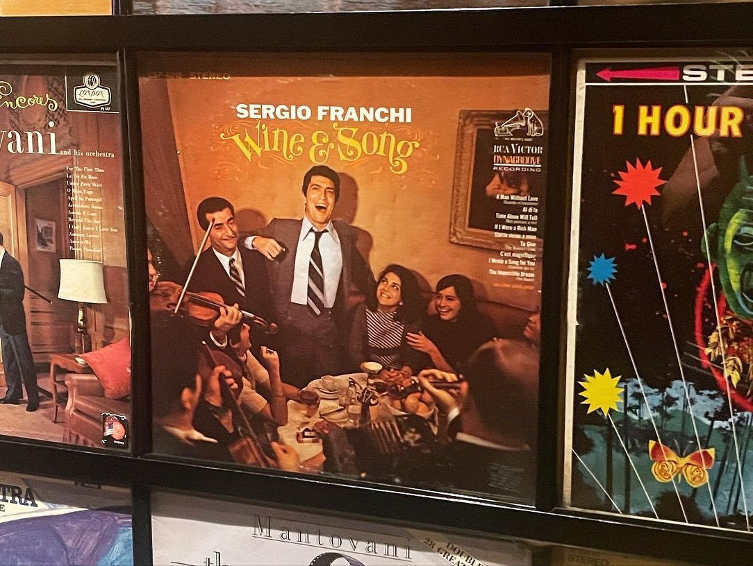Wall of record album covers at Secret Pizza