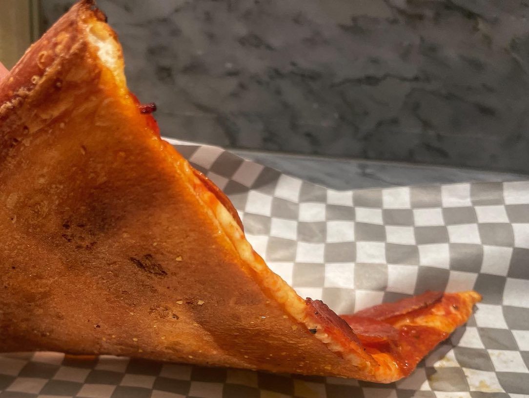 Underside of the pizza crust at Secret Pizza