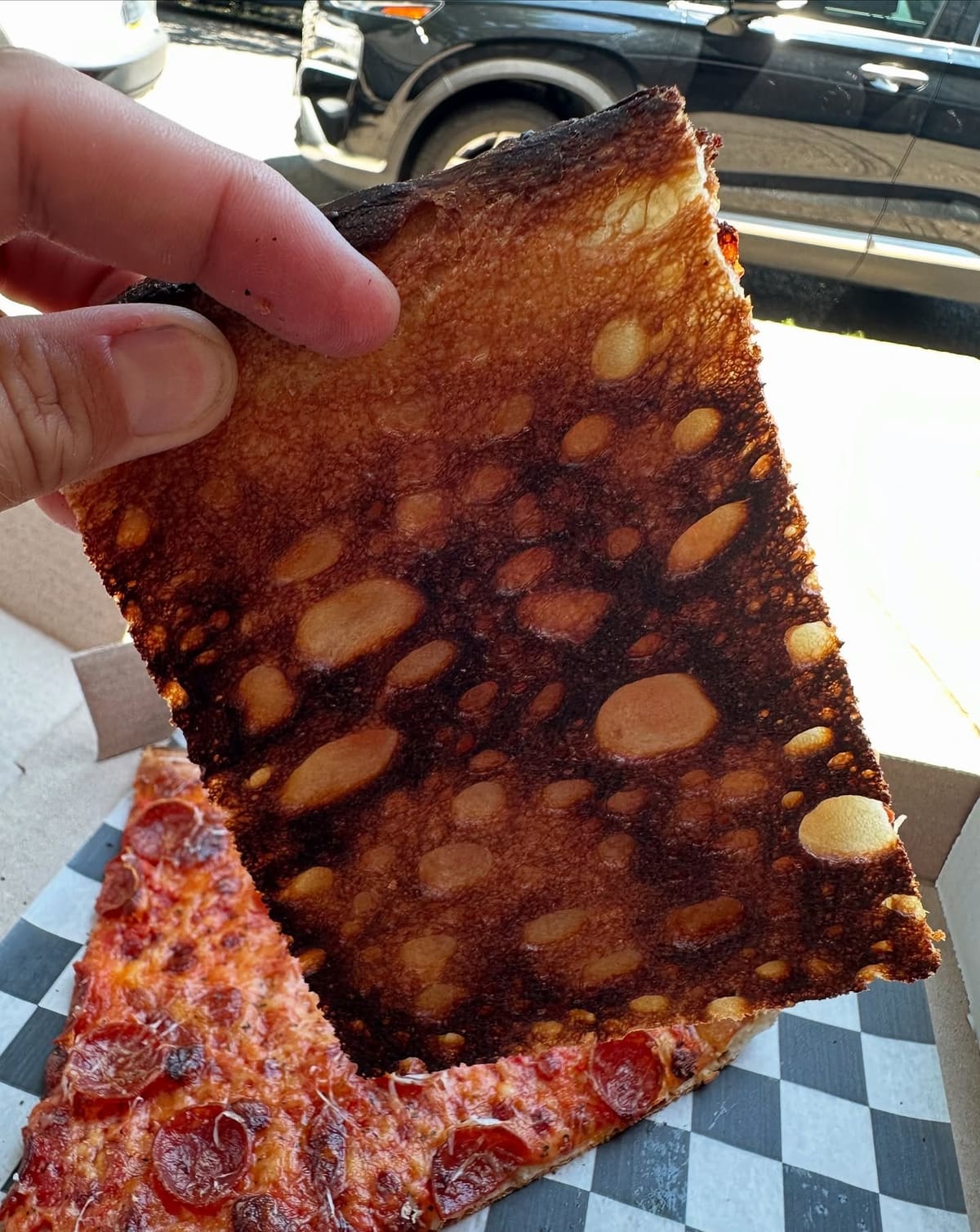 Underside of the pizza crust at Shackamaxon Pizza