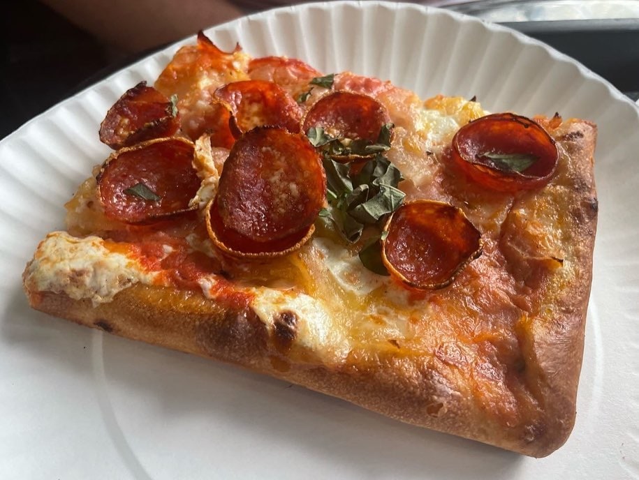 Close view of a pizza slice at Sofia Pizza Shoppe