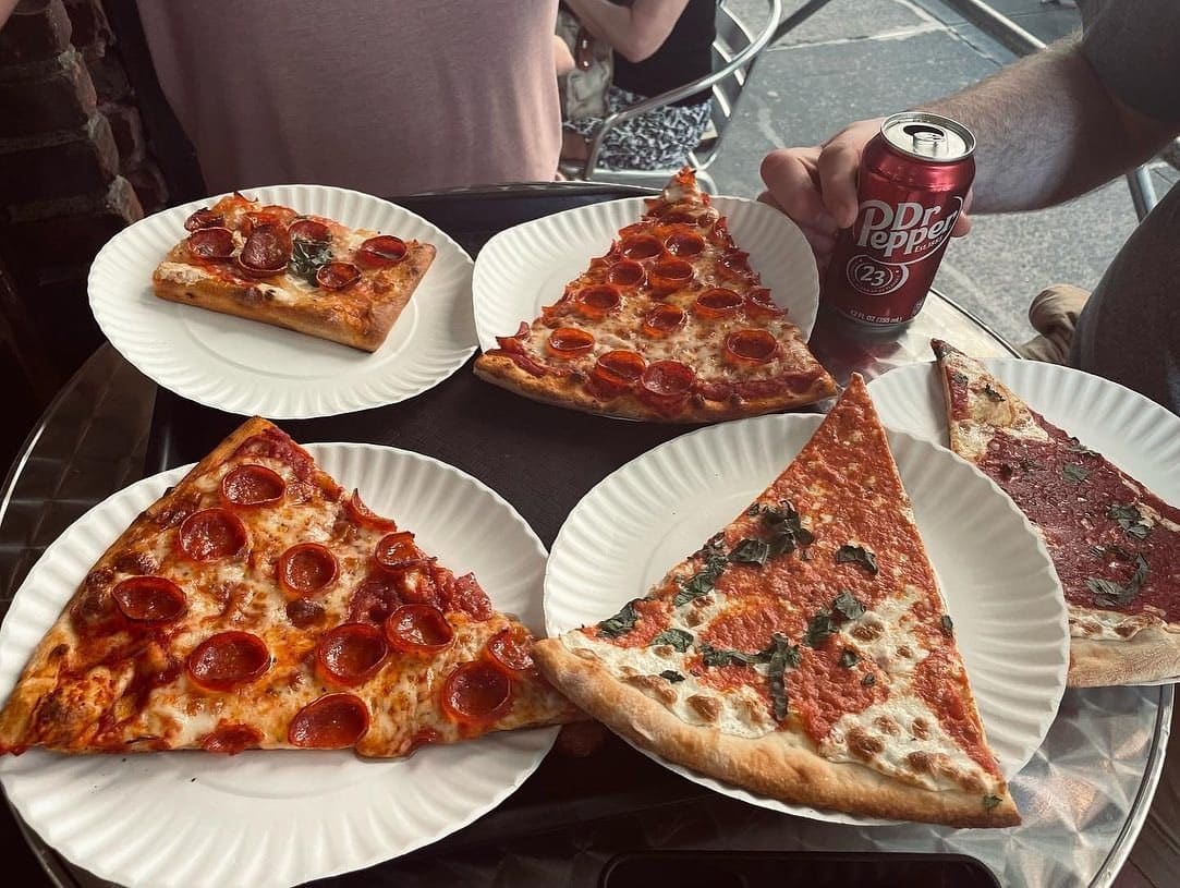 Pizza and dishes on the table at Sofia Pizza Shoppe