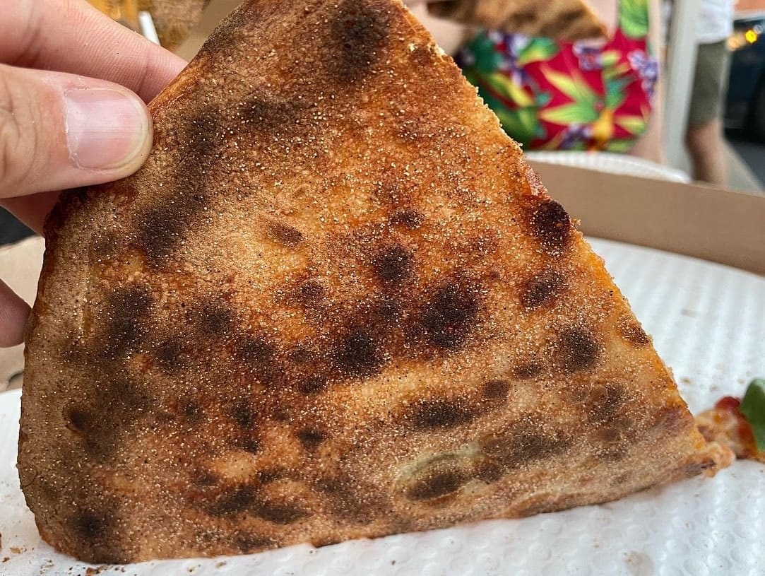 Underside of the pizza crust at St Francis Apizza