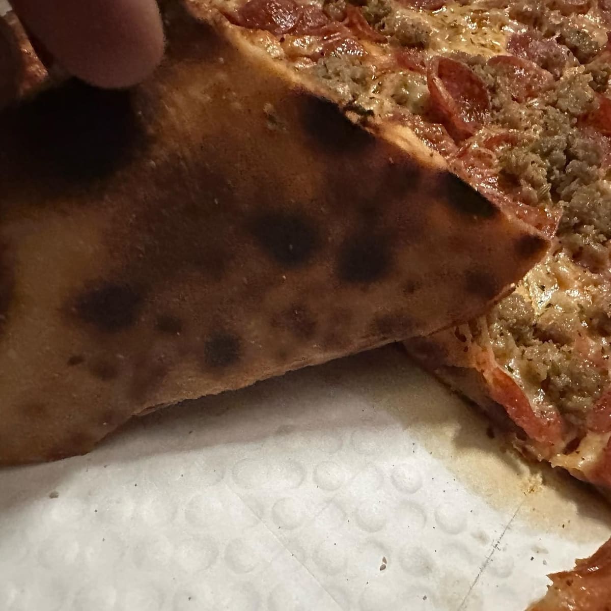 Underside of the pizza crust at St Francis Apizza / Frankie’s Thin Style