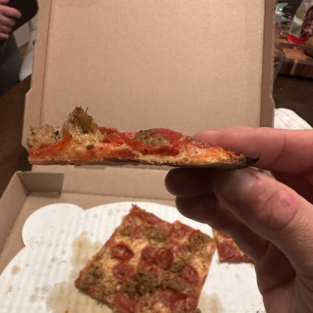 Side profile of the pizza crust at St Francis Apizza / Frankie’s Thin Style