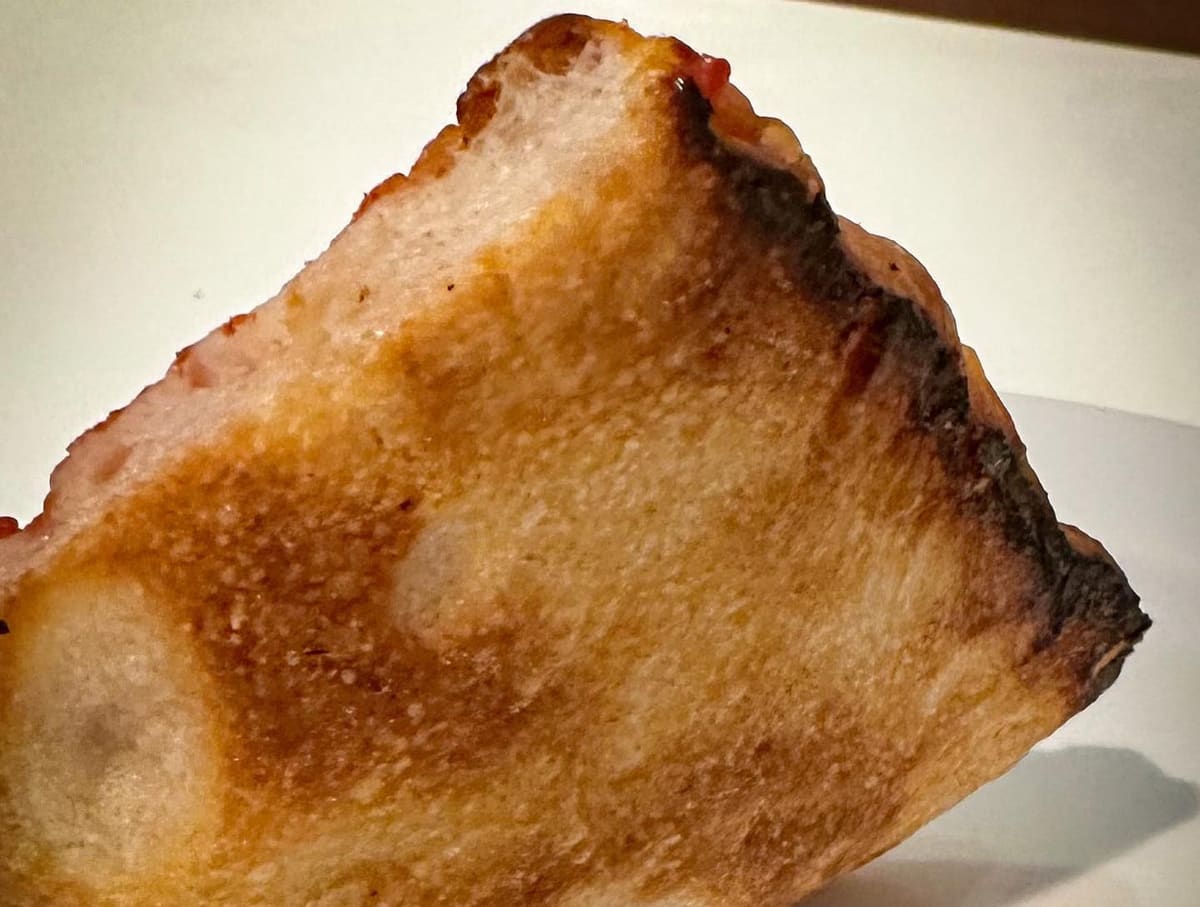 Underside of the pizza crust at Sullivan Street Bakery