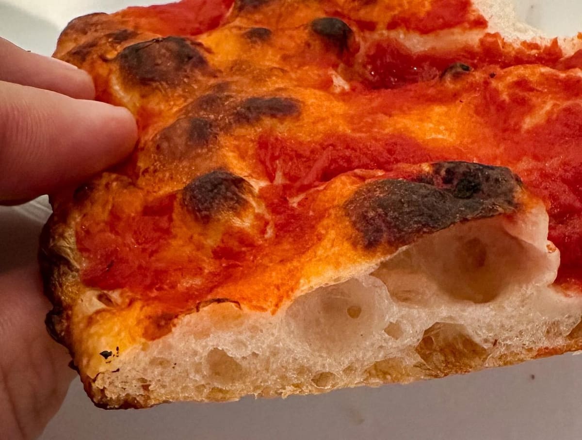 Side profile of the pizza crust at Sullivan Street Bakery