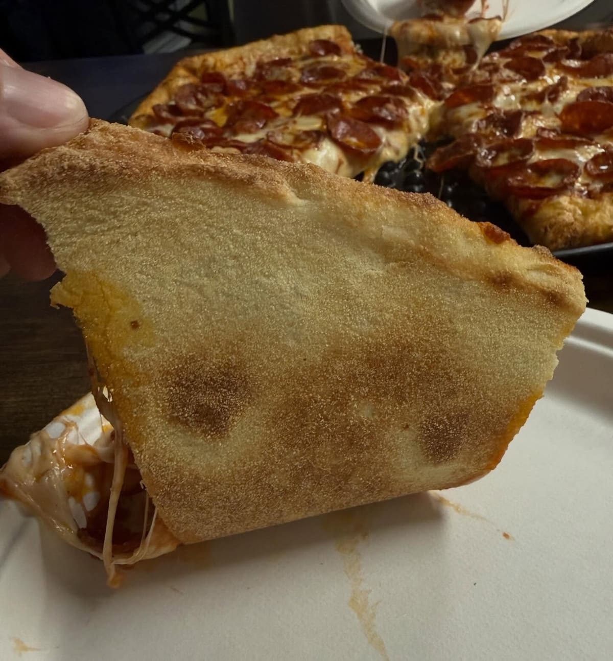 Underside of the pizza crust at Tony’s Pizzeria in Mason