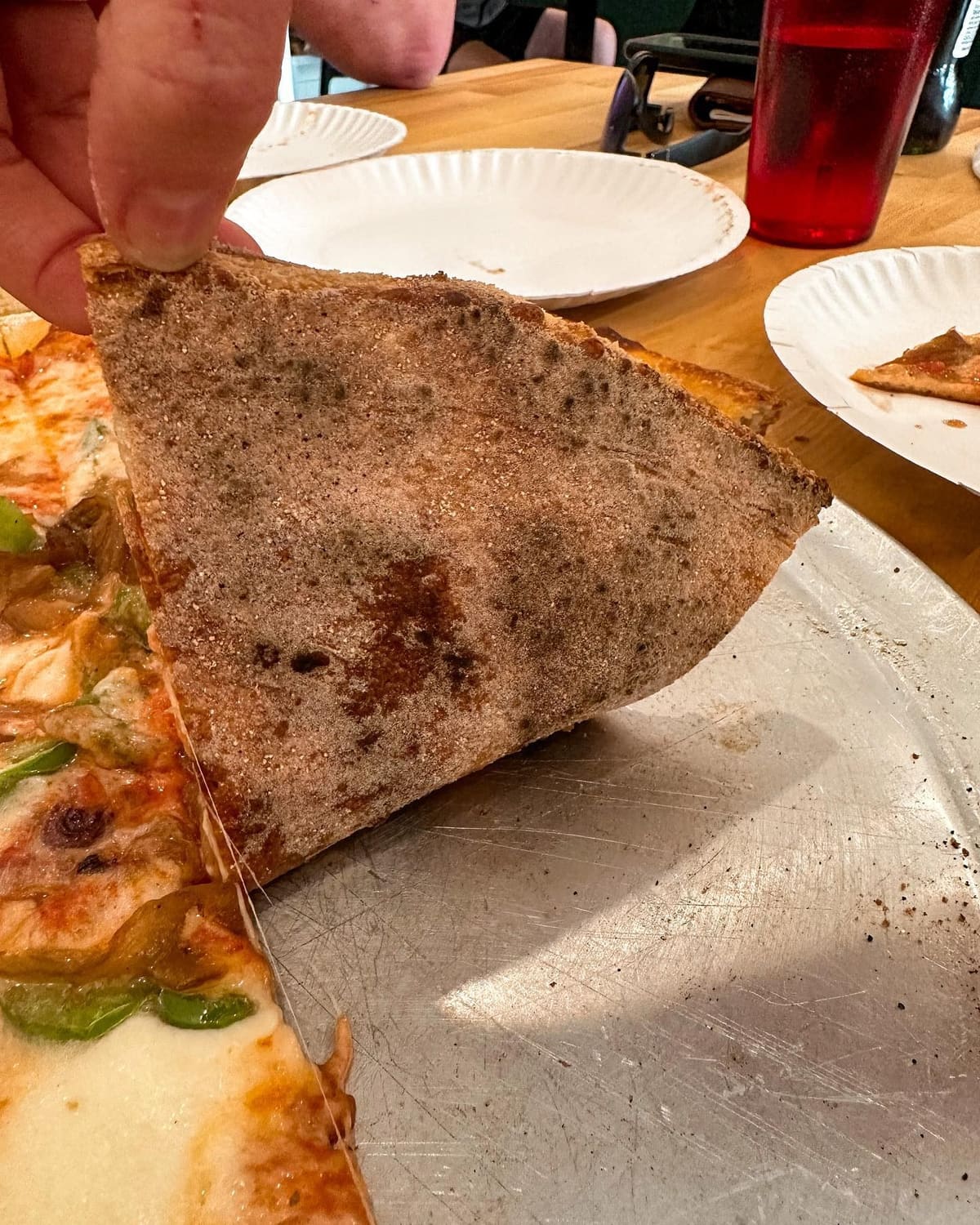 Underside of the pizza crust at Trophy Pizza