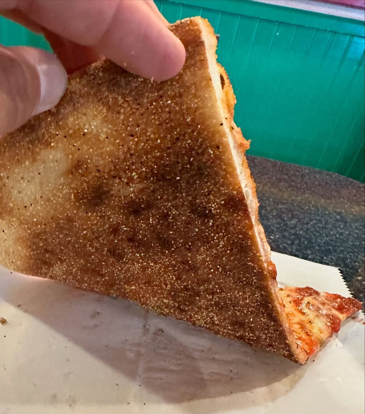 Underside of the pizza crust at Two Boots Pizza