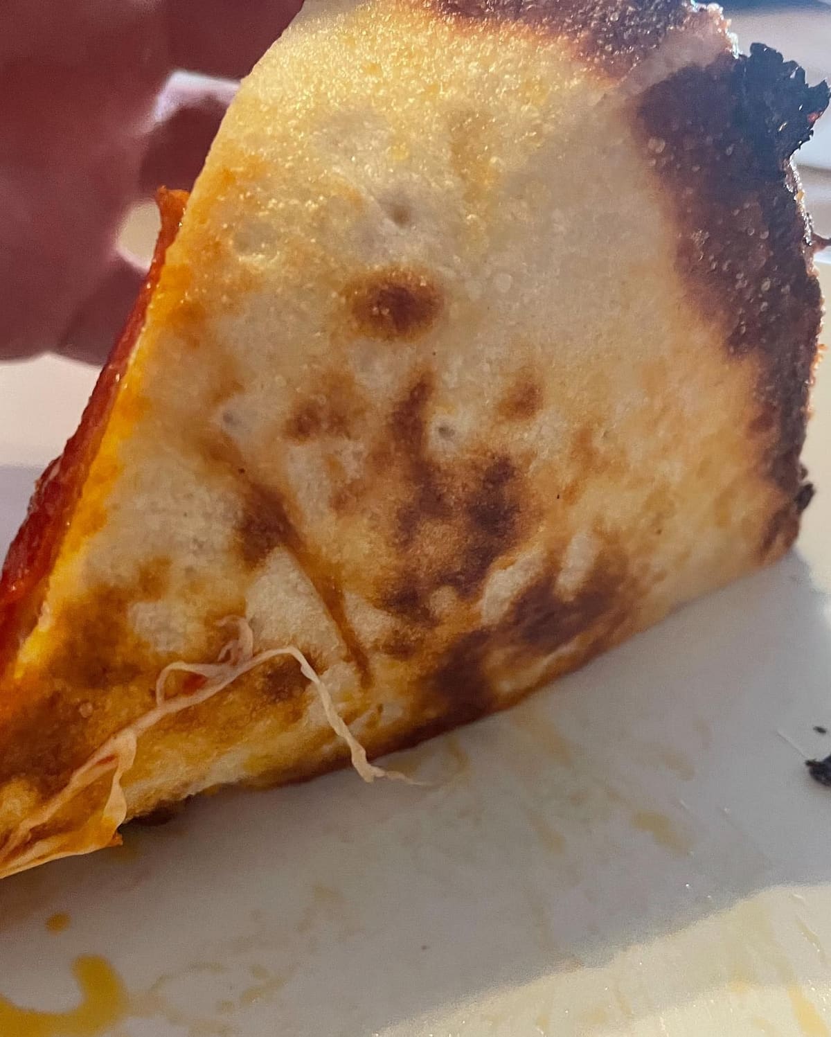 Side profile of the pizza crust at Two Cities Pizza Co