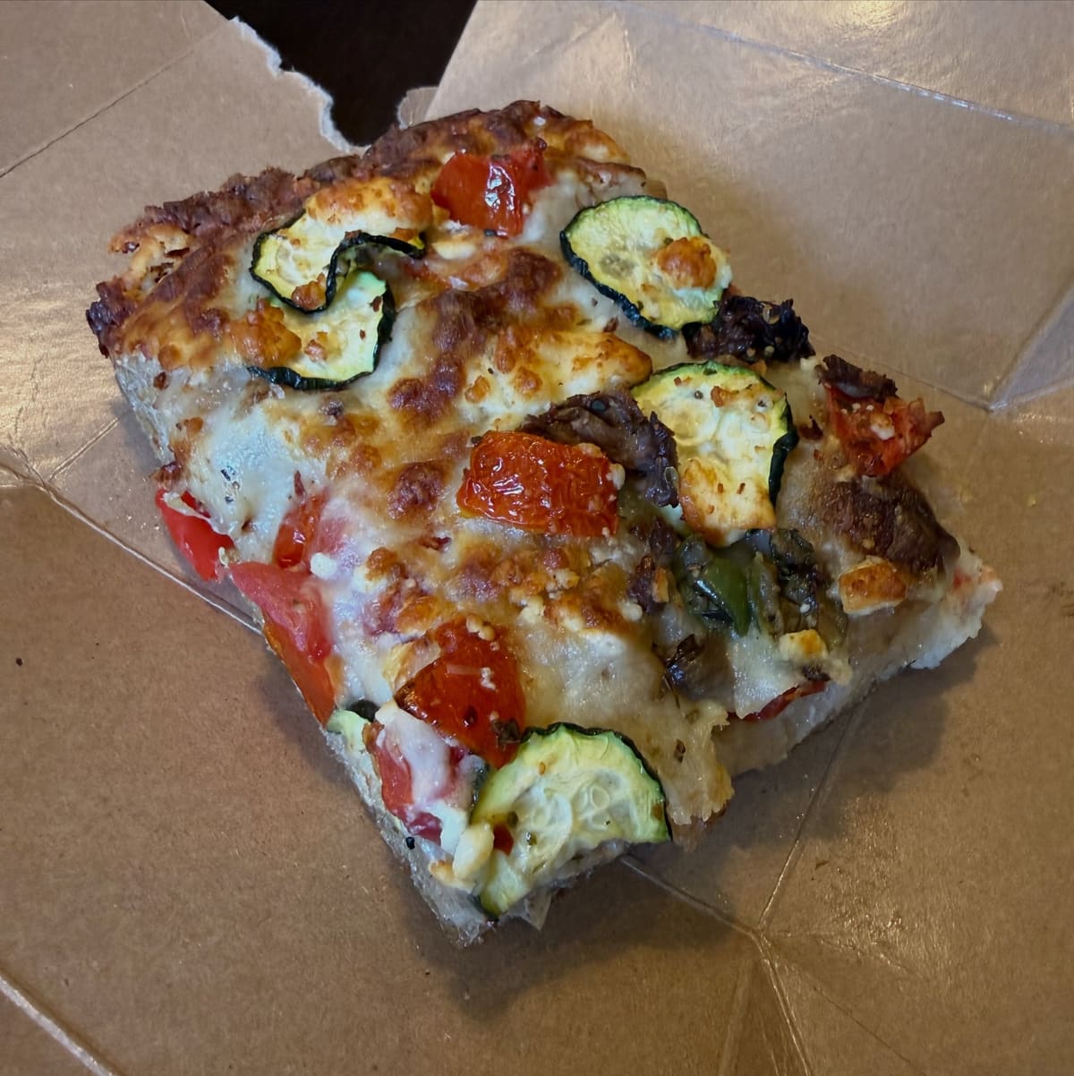 Close view of a pizza slice at Two Seven Two