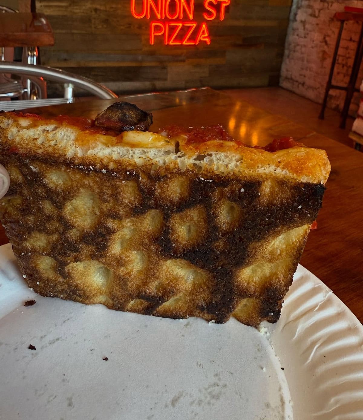 Underside of the pizza crust at Union Street Pizza in Brooklyn
