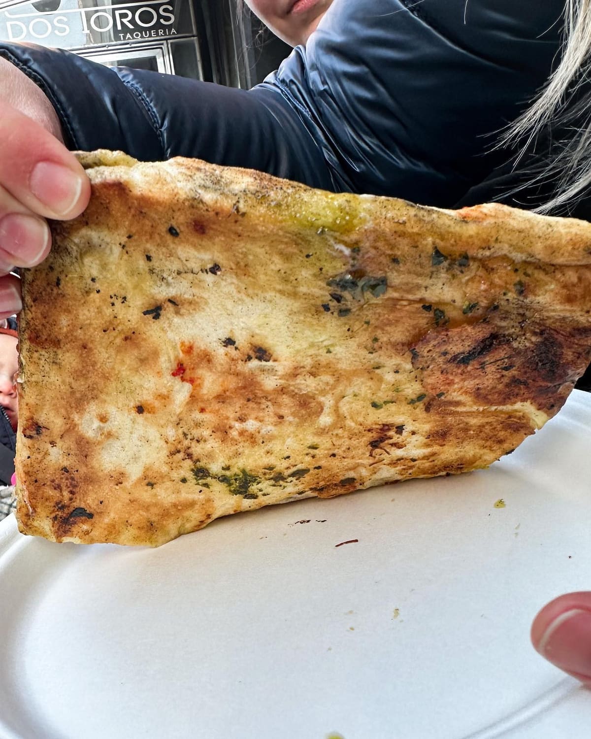 Underside of the pizza crust at Unregular Pizza