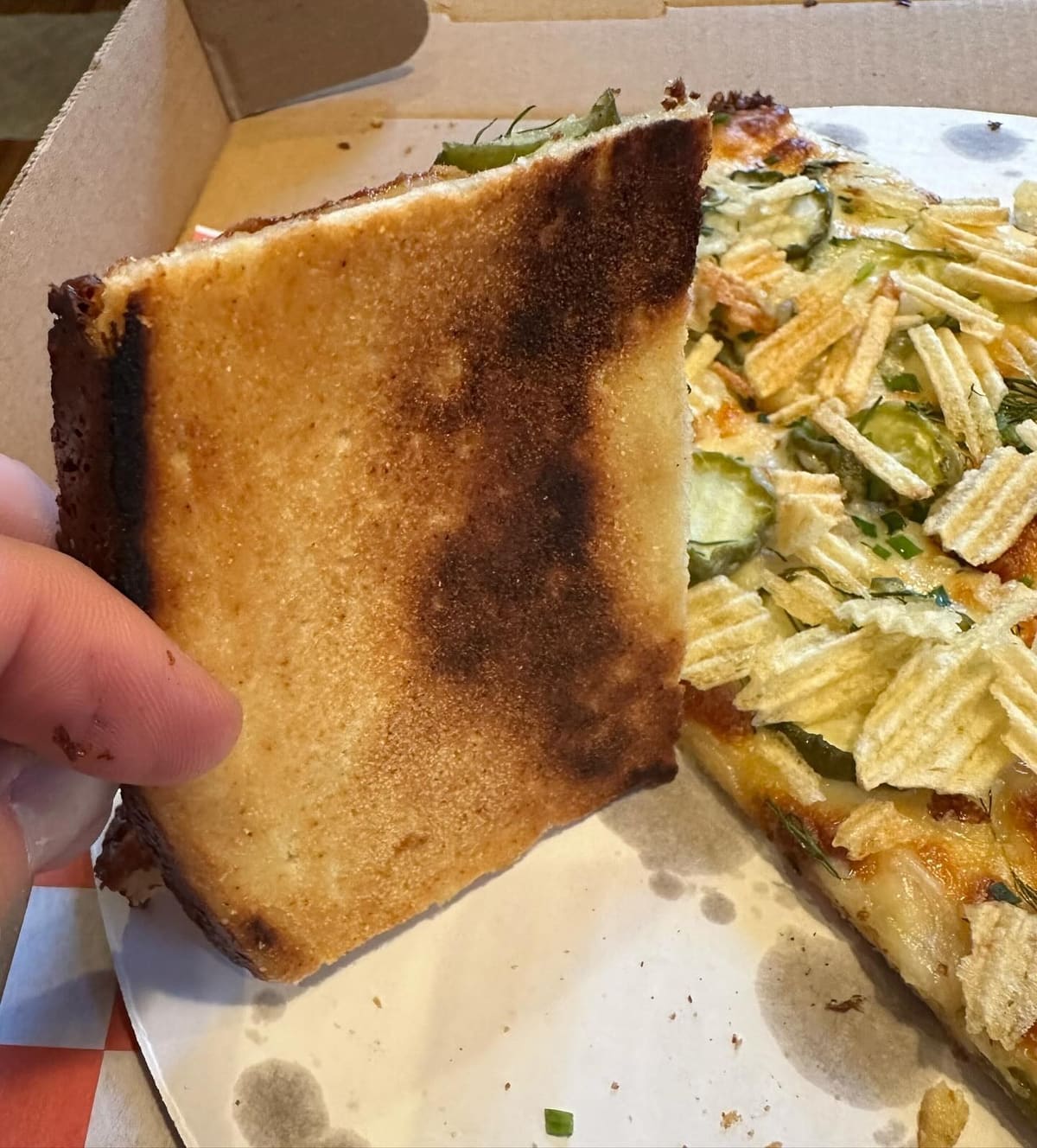 Underside of the pizza crust at Wayfarer Pizza