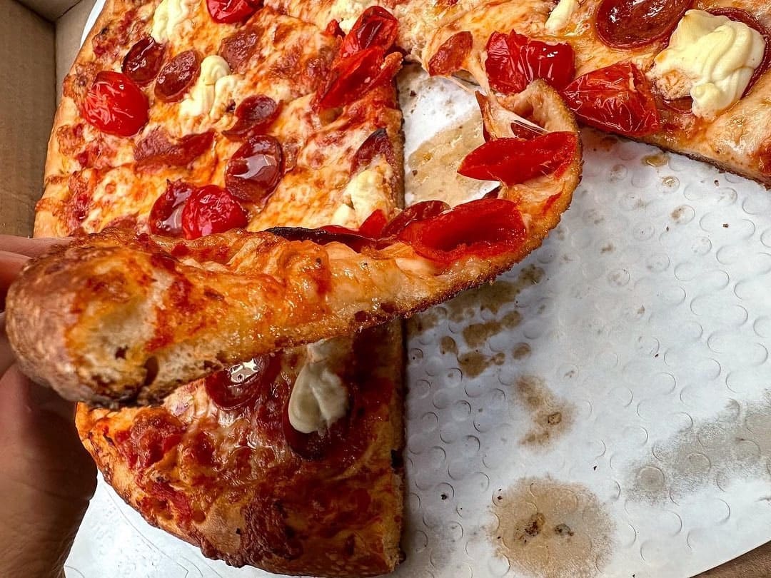 Pizza slice at Your Mom’s Pizzeria