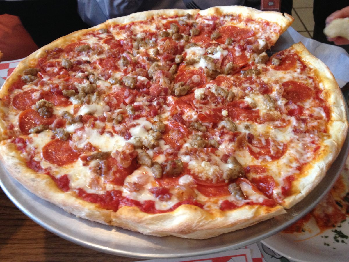 charred, cheese-heavy pie stacked with pepperoni, sausage, and ham, Giovanni's
