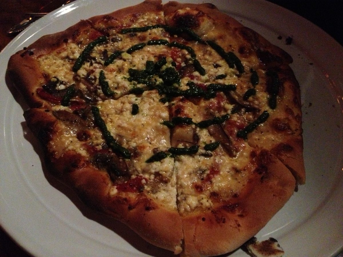 Pesto-drizzled pie with mushrooms and cheese, Incline Public House