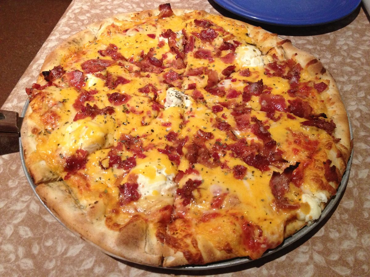 cheddar bacon pizza dotted with white cheese, Jockamo Upper Crust Pizza