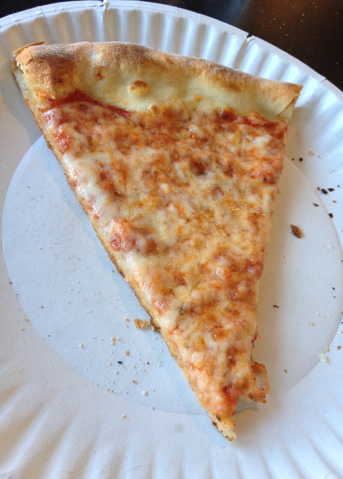Wide cheese slice with a golden charred crust edge, Armitage Pizzeria