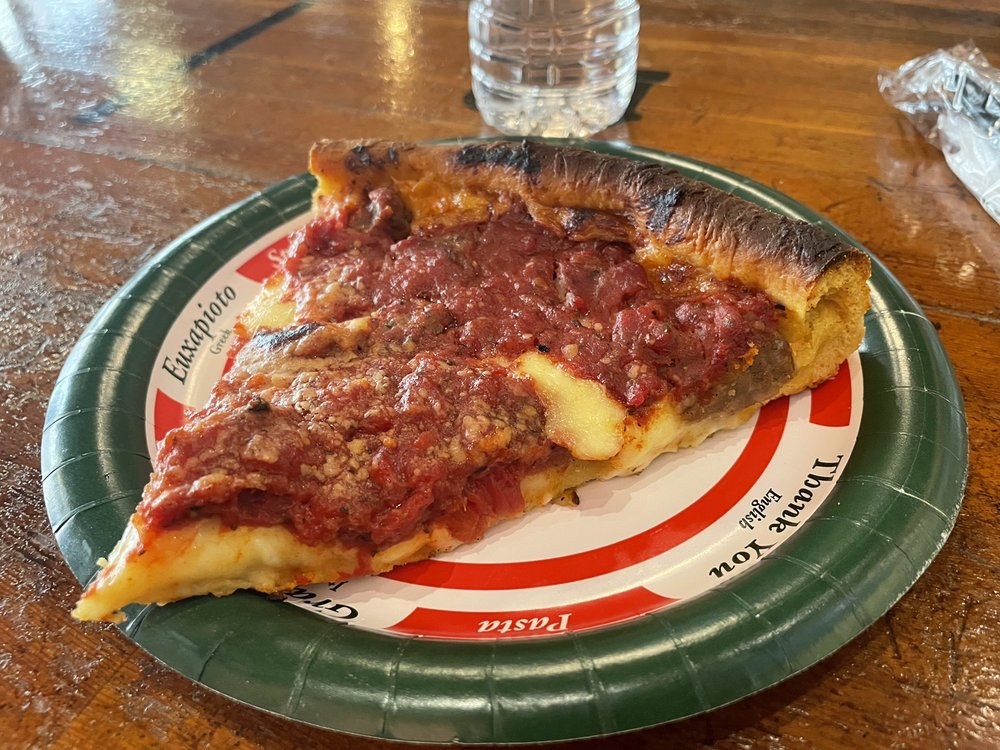 Deep dish slice under chunky sausage-studded tomato sauce, Bartoli's Pizza