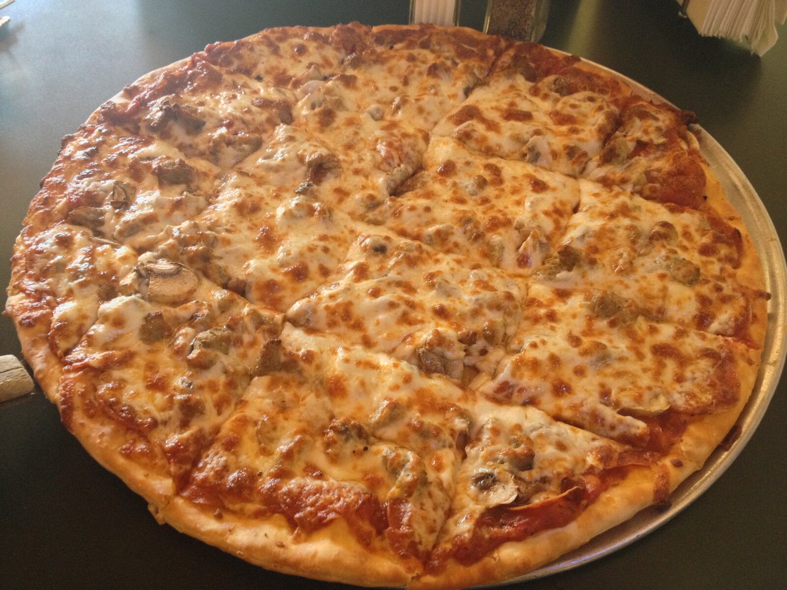 pale-baked pie loaded with mushrooms and melted cheese, Fort Thomas Pizza