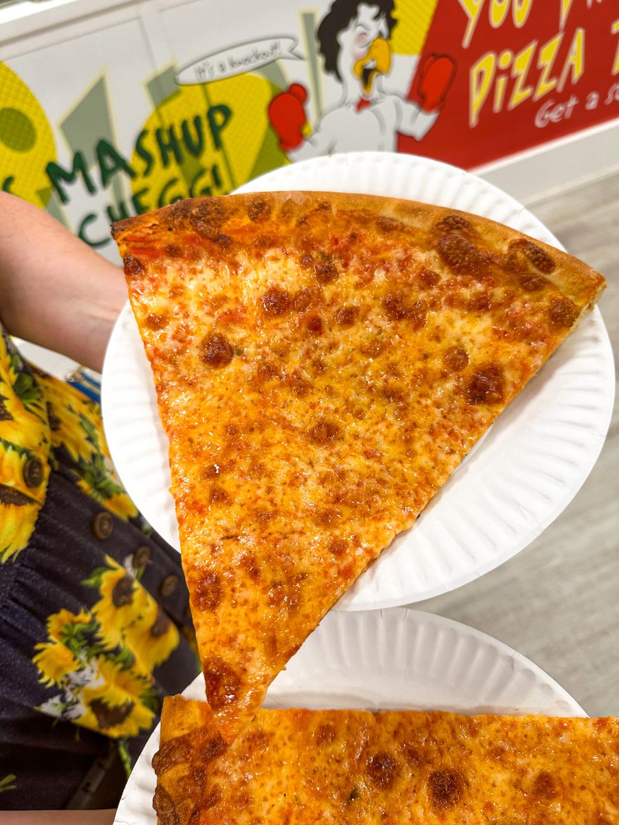 hand holding an oversized plain cheese slice, Lorenzo’s Pizza