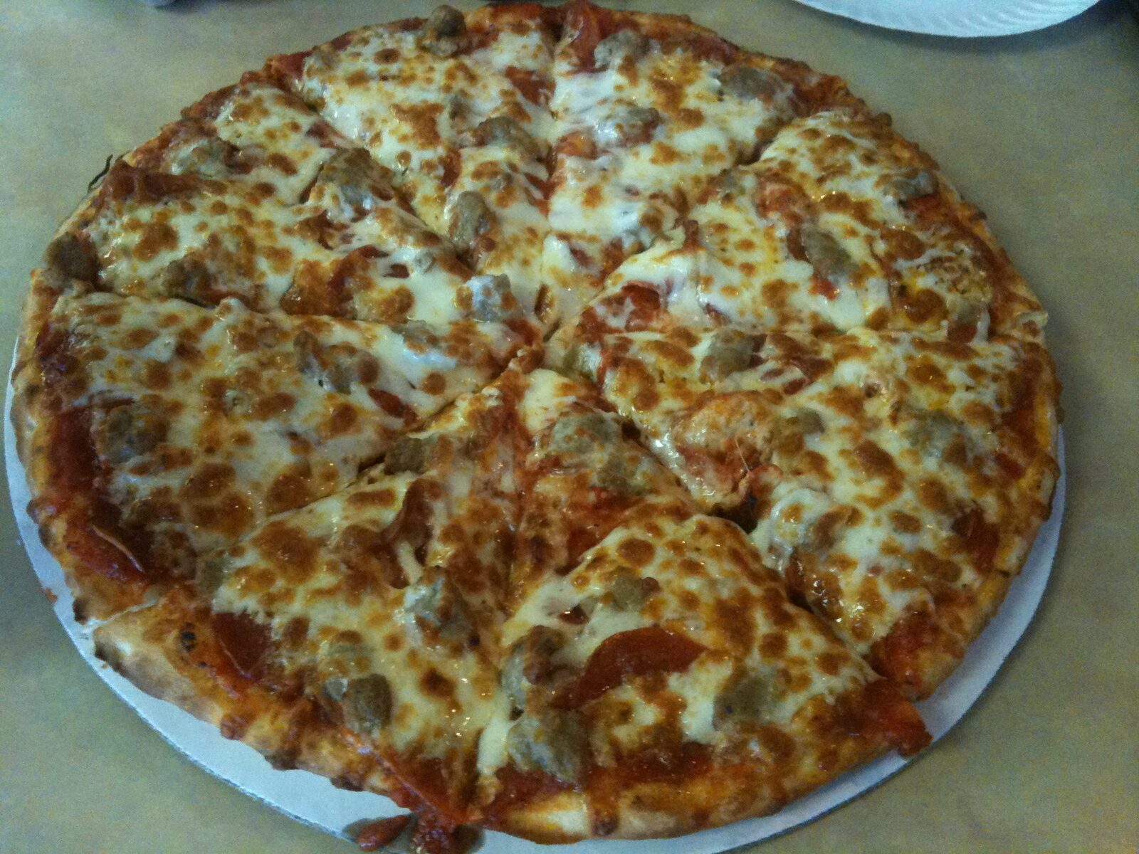 cracker-thin party-cut pizza with sausage crumbles, Richard's Pizza
