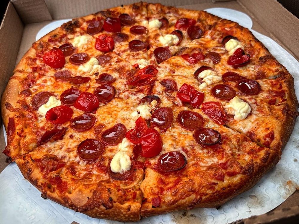 Pepperoni pie topped with ricotta dollops and peppadews, Your Mom’s Pizzeria