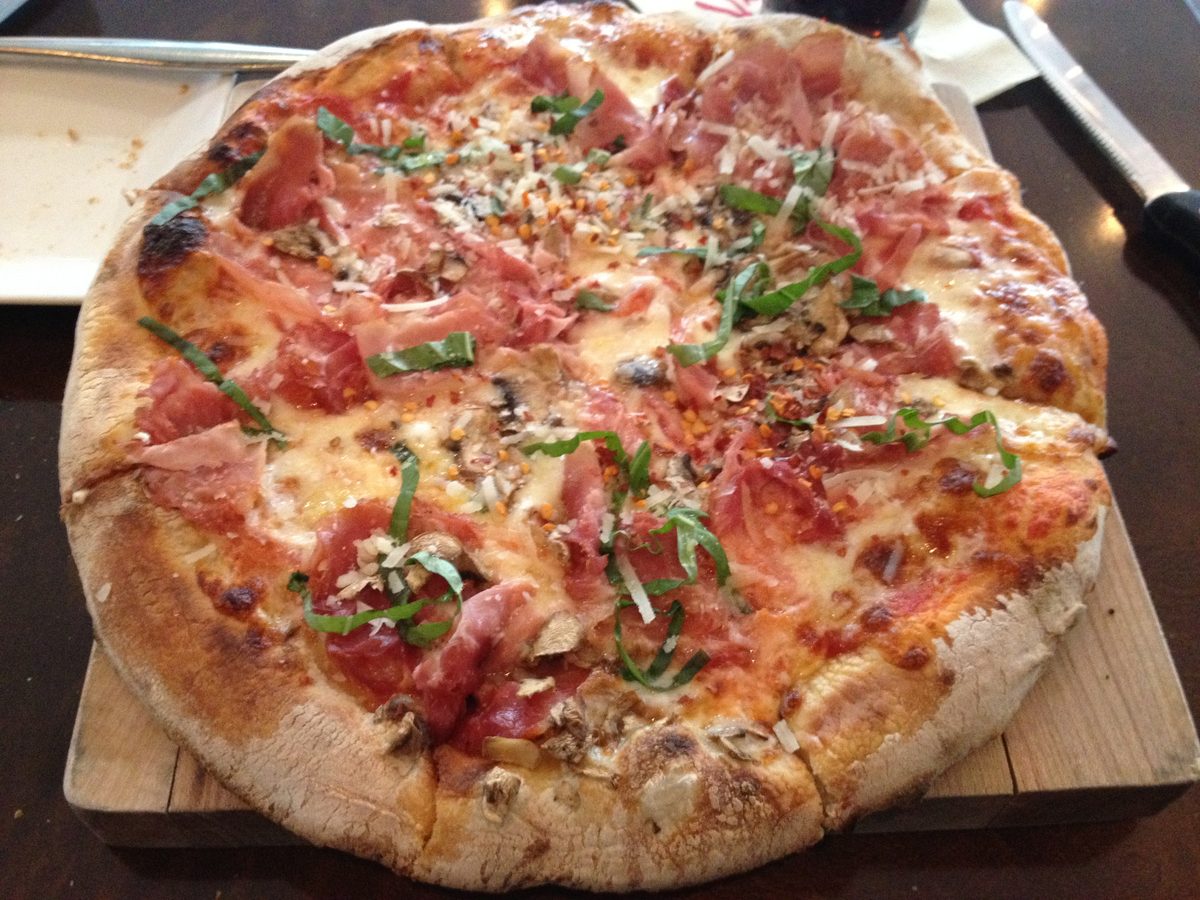 Neapolitan pie with prosciutto, basil ribbons and shaved parmesan, Via Vite